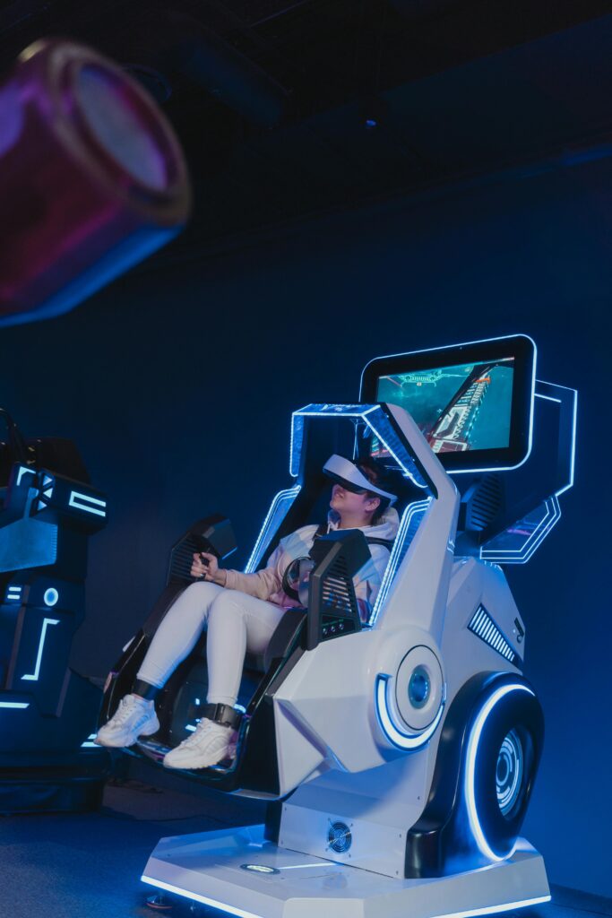 A woman engaged in a virtual reality experience in a futuristic VR gaming simulator.